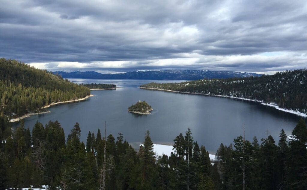 lake tahoe with dark sky and snow